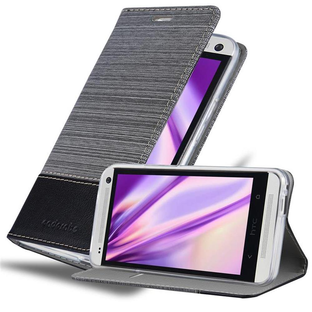 Funda gris para teléfono con un teléfono dentro. Fondo blanco y negro. Teléfono abierto.