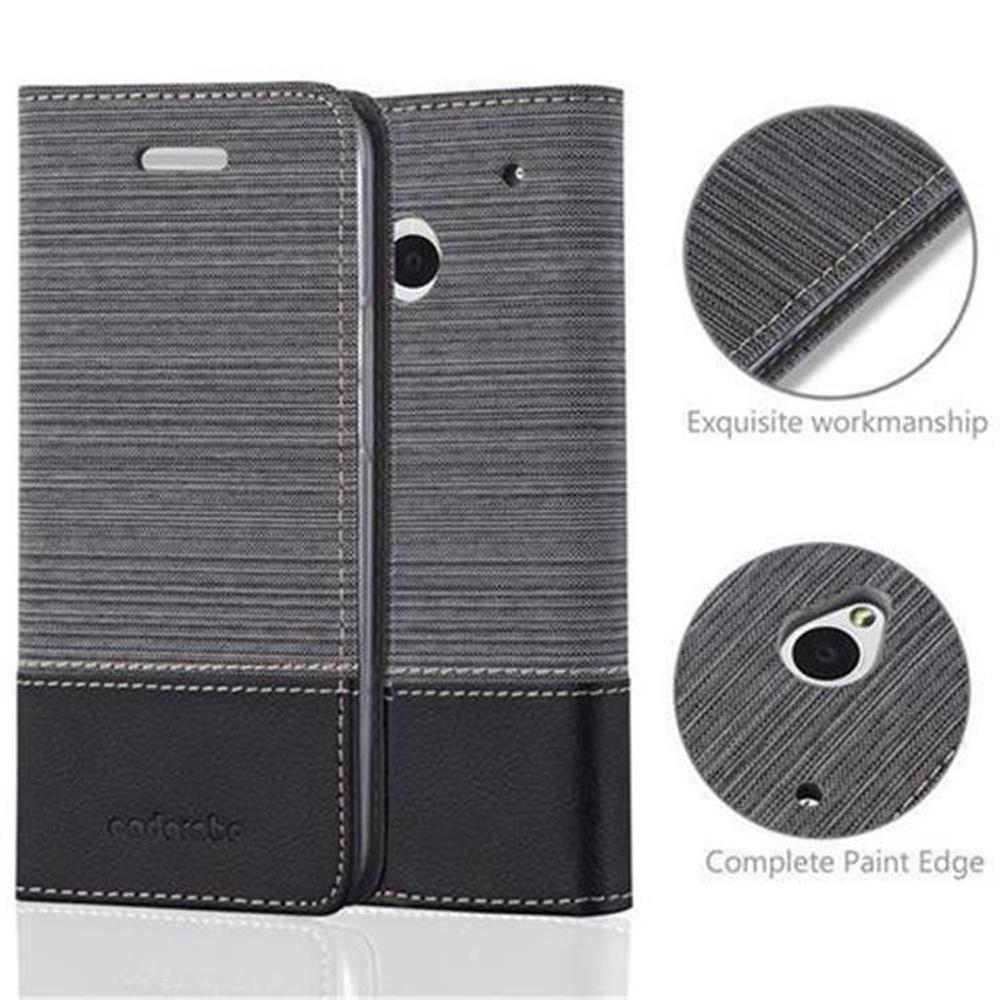 Funda gris para teléfono abierta. Cuero negro y gris. Se muestra detalle de mano de obra exquisita.