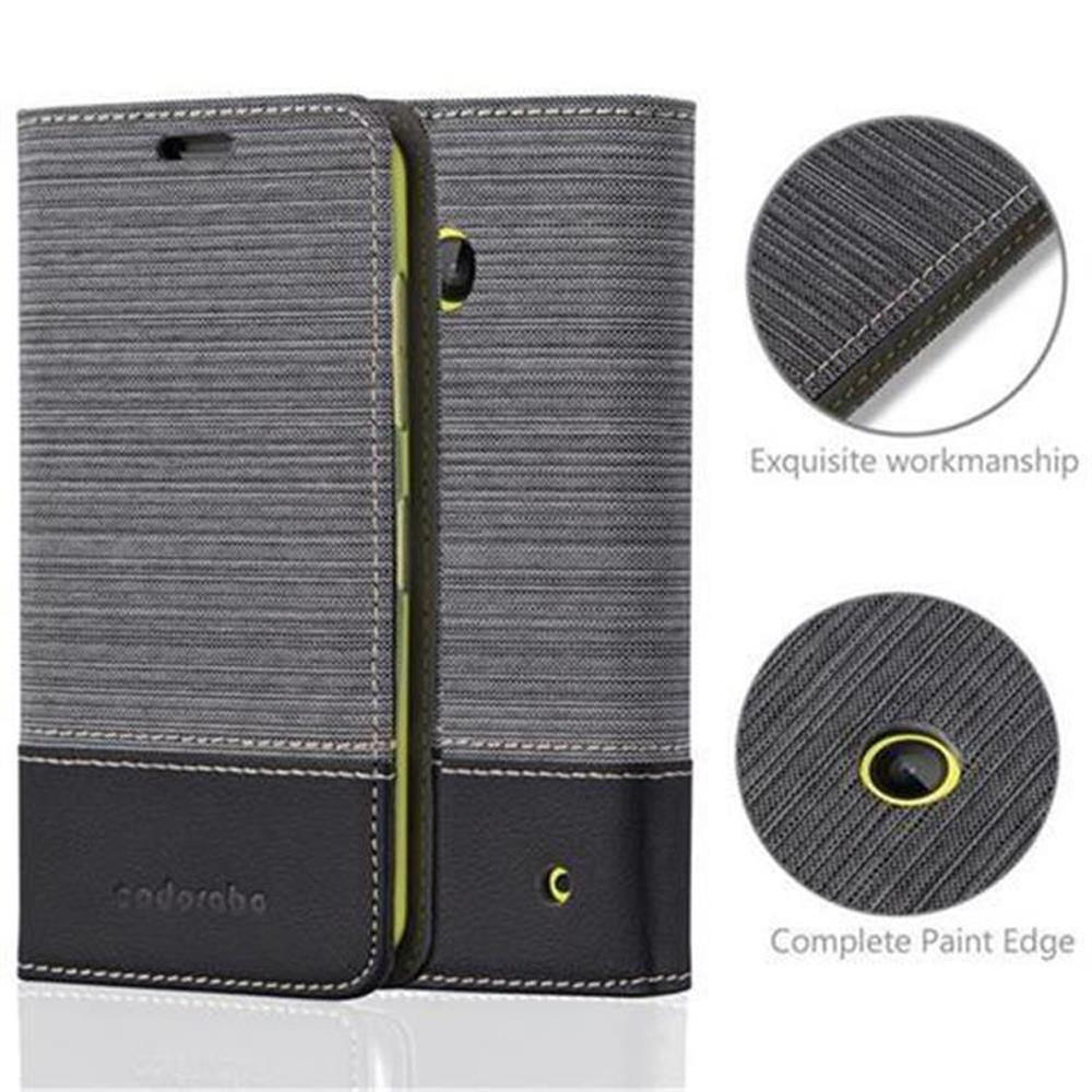 Una funda gris y negra para teléfono. La imagen muestra la funda abierta, con una vista de sus detalles.