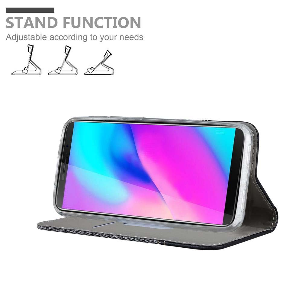 Telefon in grauem Gehäuse, offen, abgewinkelt. Standfunktion. Drei Standdiagramme oben.