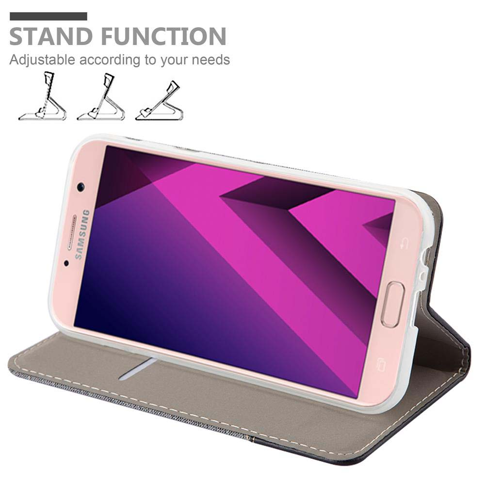 Un telefono Samsung rosa all'interno di una custodia. Il testo recita 'STAND FUNCTION'. La custodia è aperta.