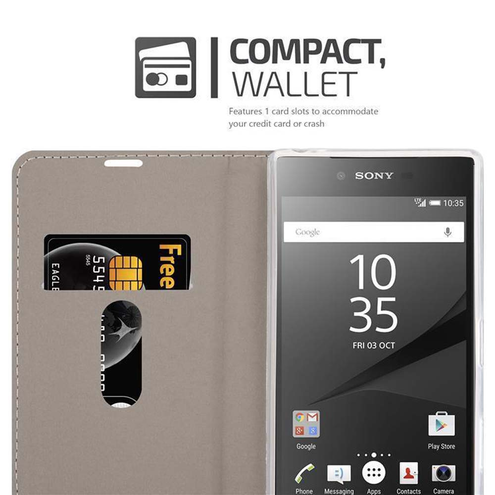 Ein schwarzes Telefon mit einer Kreditkarte in einer grauen Geldbörsenhülle. Ein COMPACT, WALLET-Schild.