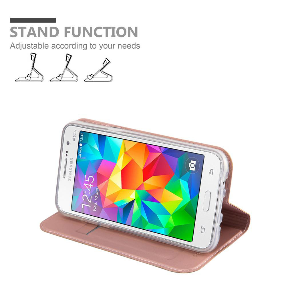 Smartphone en una funda rosa con función de soporte. El teléfono está sobre una mesa y muestra un reloj.