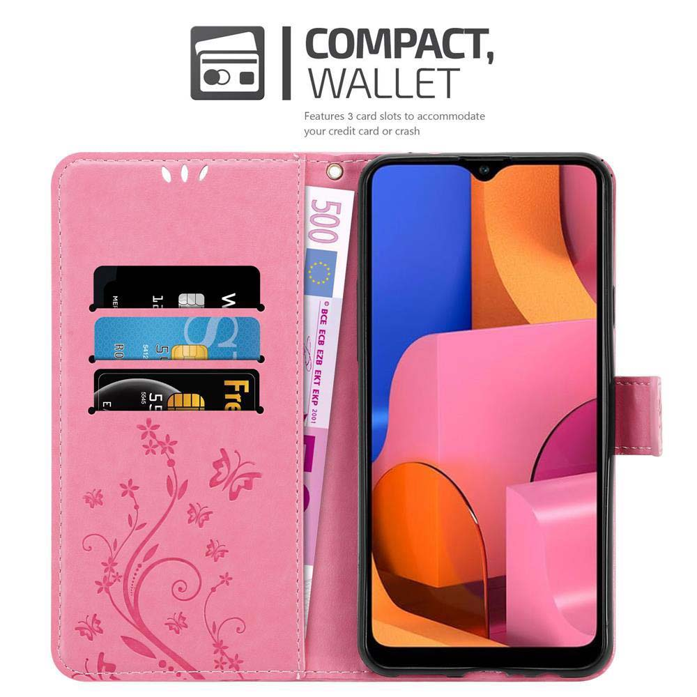 Custodia a portafoglio rosa con carte e denaro all'interno. Un telefono a destra. Con fessure per carte.