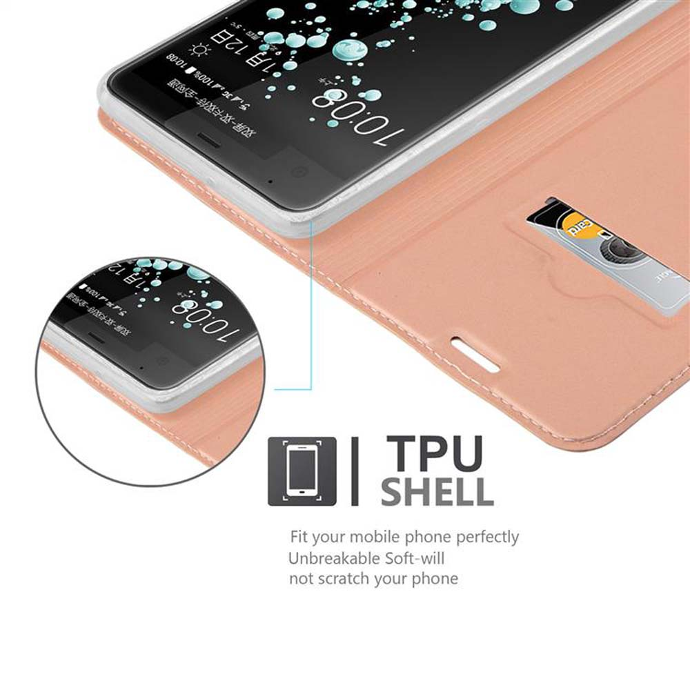 Custodia rosa con telefono. Il telefono mostra l'ora. La custodia ha uno slot per schede ed è aperta.