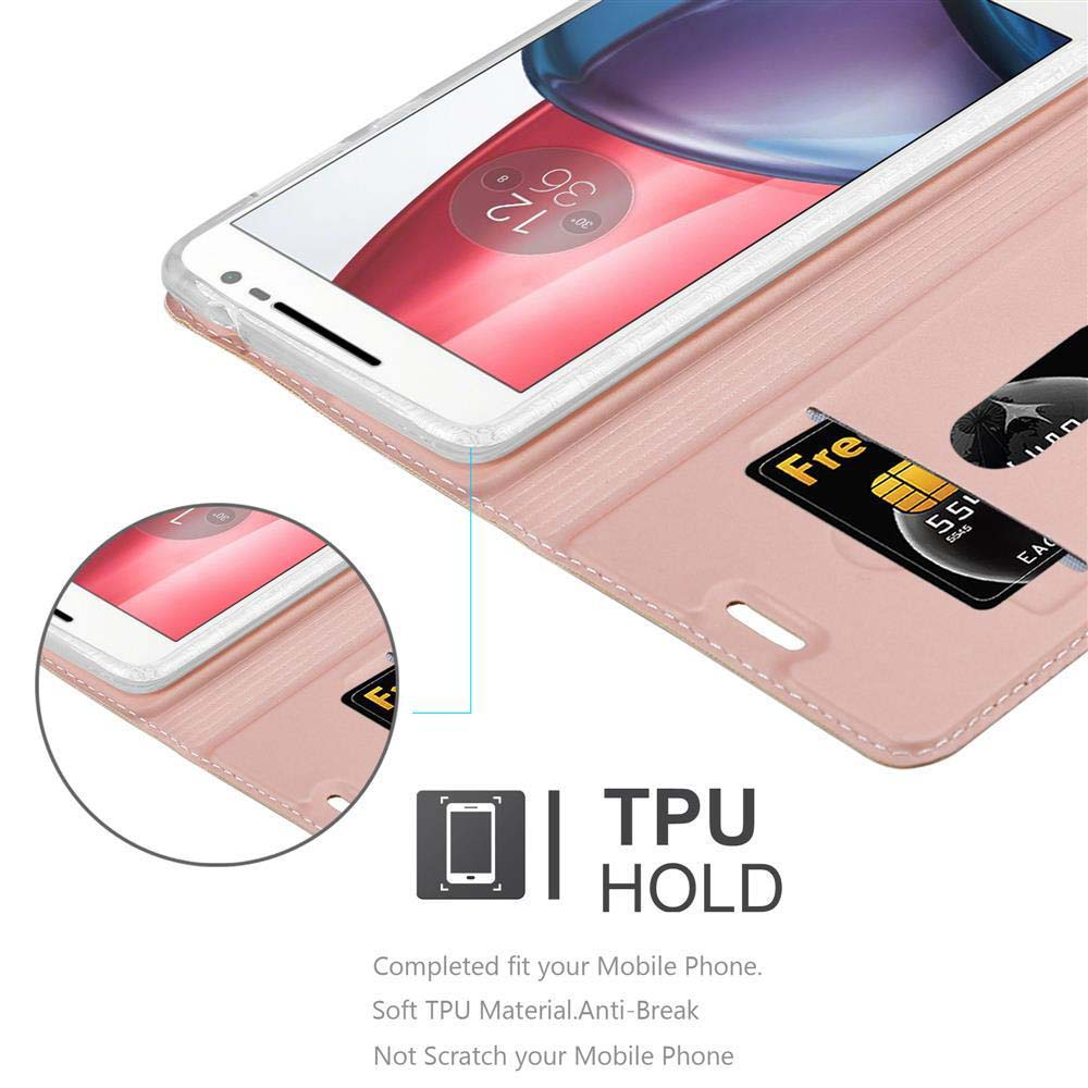 Funda de teléfono rosa abierta, mostrando un teléfono y una tarjeta de crédito. La funda dice TPU HOLD.