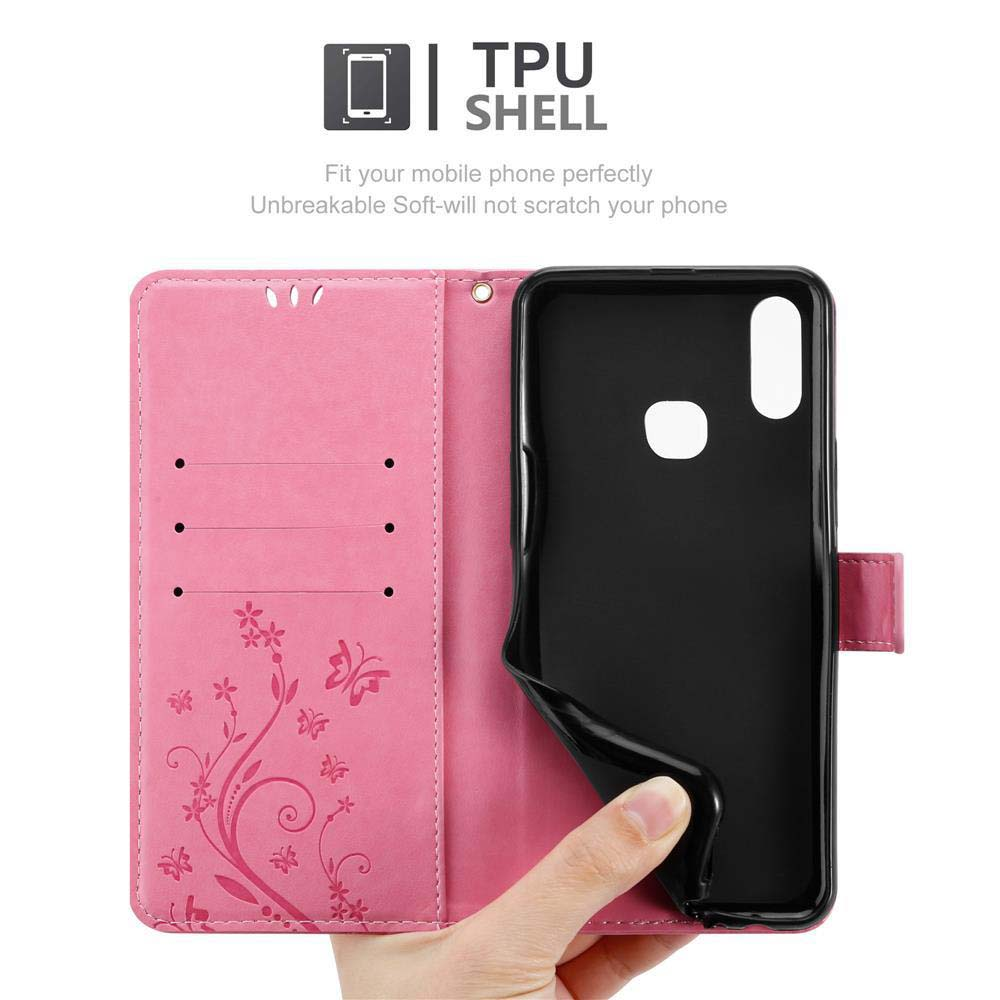 Una custodia rosa per telefono è aperta. Il telefono è in una custodia nera, con design floreale.