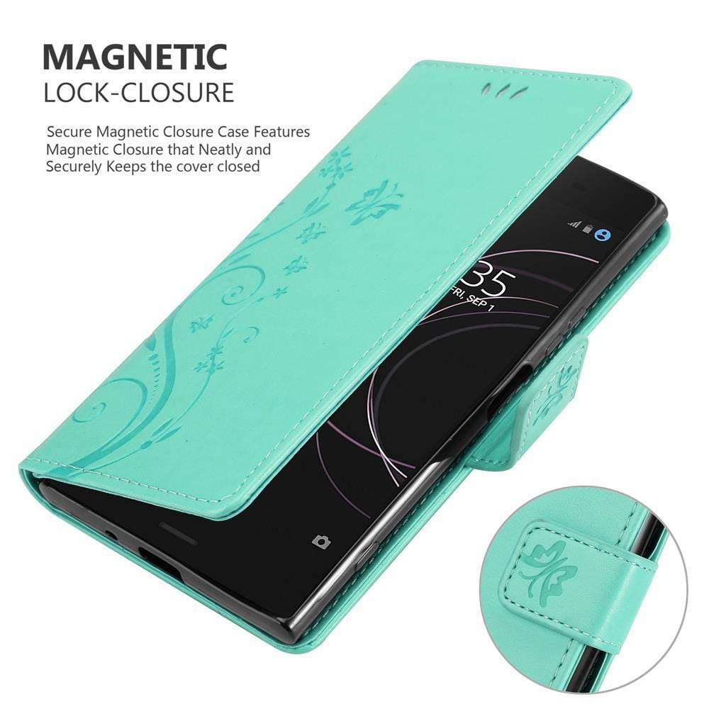 Una custodia per telefono verde acqua con un design floreale, aperta per rivelare un telefono nero. La custodia ha una chiusura magnetica.