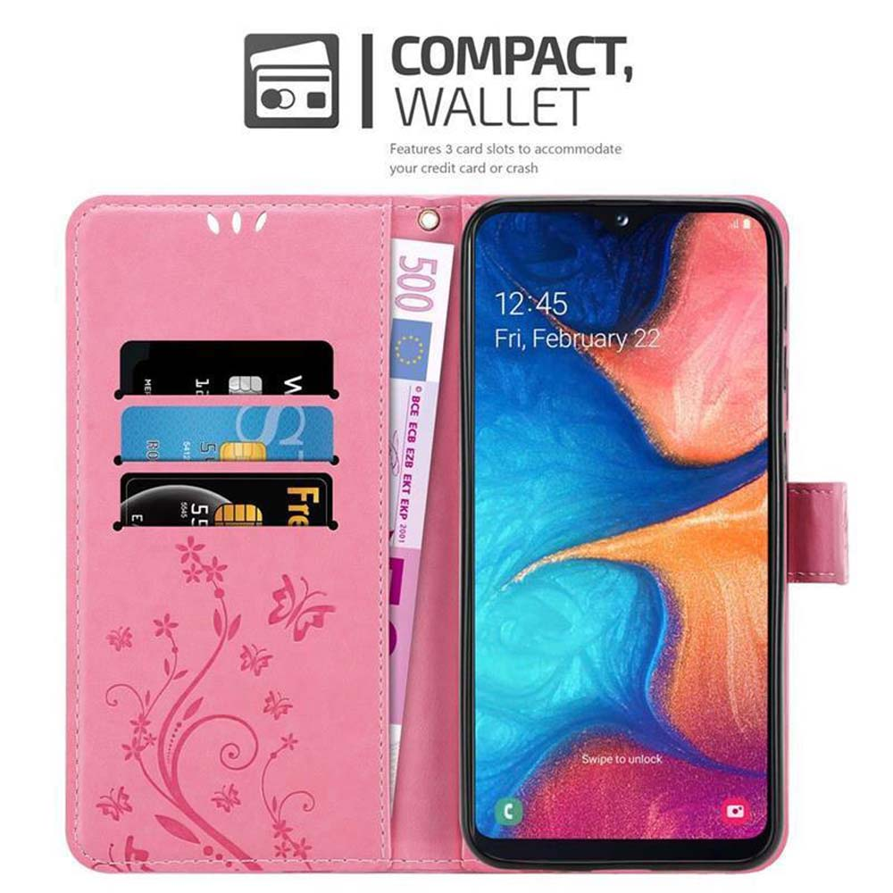 Custodia a portafoglio rosa con carte di credito, denaro e telefono con data.