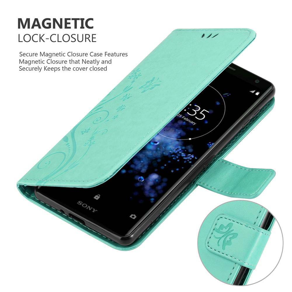 Custodia turchese con un telefono. Il telefono mostra l'ora. La custodia è aperta e ha un design.