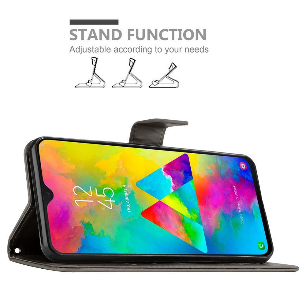 Telefono in una custodia, con schermo colorato. Visualizza l'ora e la data. La custodia può essere usata come supporto.