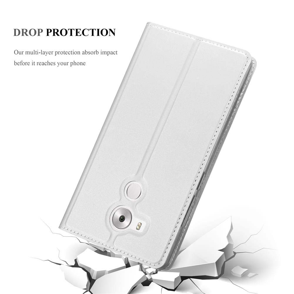 Funda de teléfono blanca, suelo agrietado debajo. Texto: Protección contra caídas. La funda está abierta.