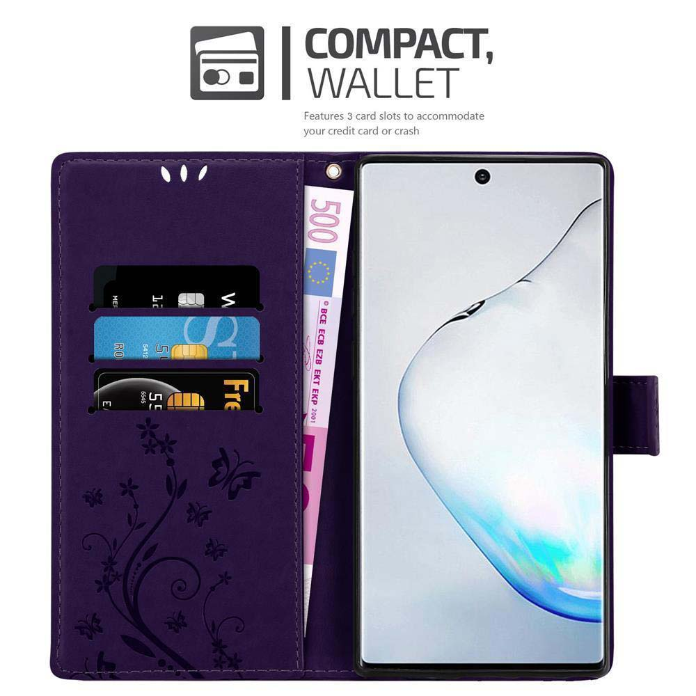Custodia a portafoglio viola, con telefono, carte e denaro all'interno.