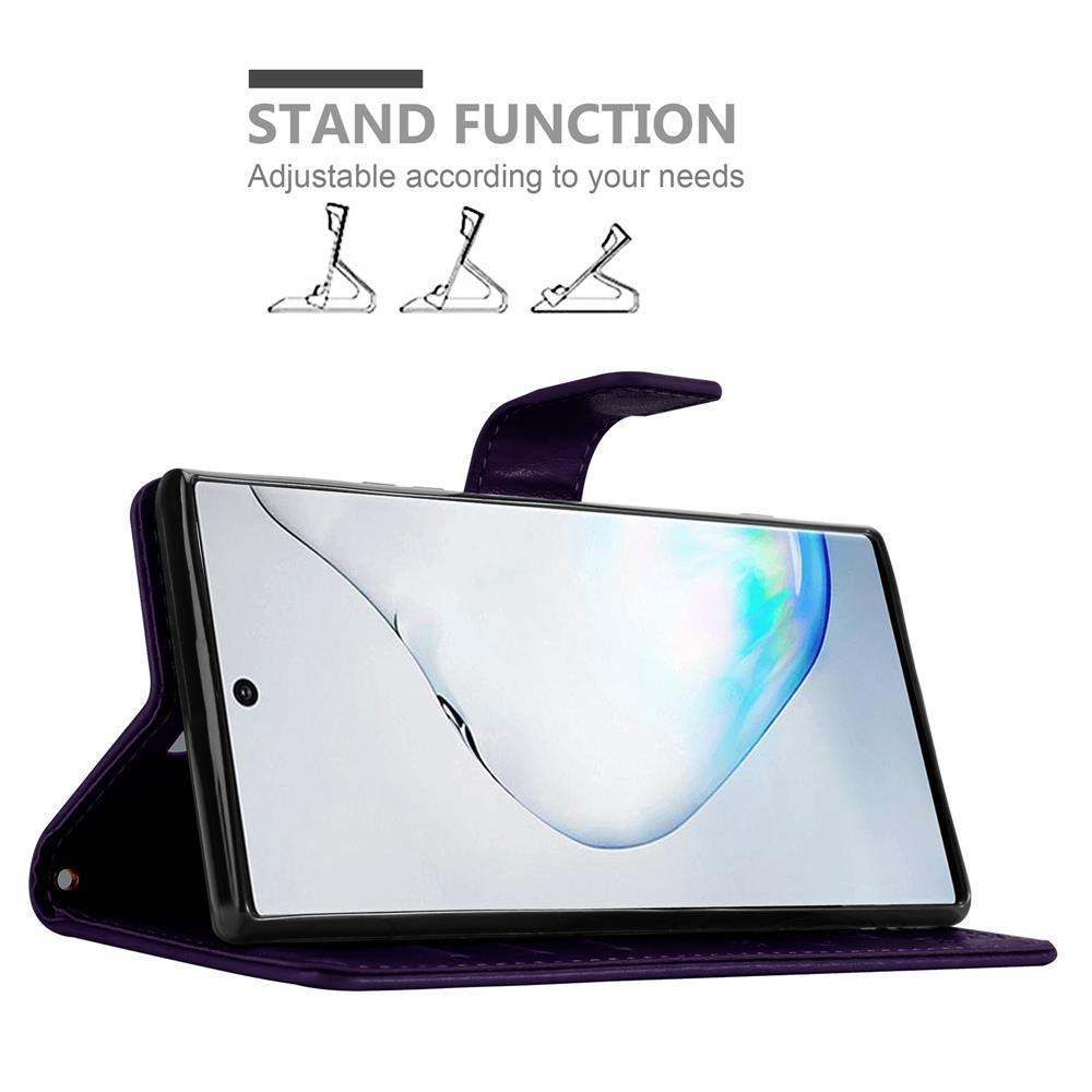 Custodia per telefono viola con telefono all'interno. Testo: funzione stand. Il display del telefono mostra uno sfondo colorato.