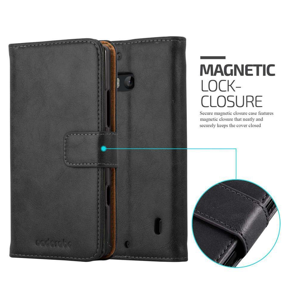 Funda de teléfono negra, con cierre magnético. Primer plano del detalle del cierre.