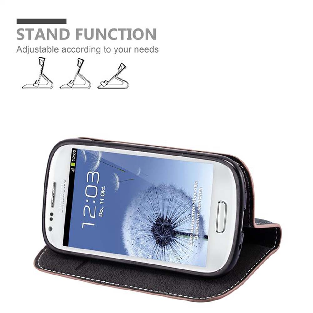 Ein Telefon in einer Hülle. Der Bildschirm des Telefons zeigt eine Uhr und eine Pusteblume.