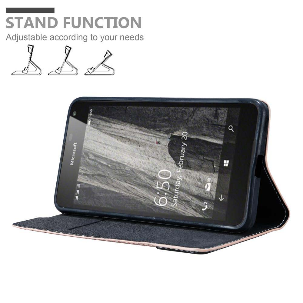 Funda de teléfono negra con teléfono dentro. El teléfono está apoyado. El texto dice 'Función de soporte'. Fondo rosa.