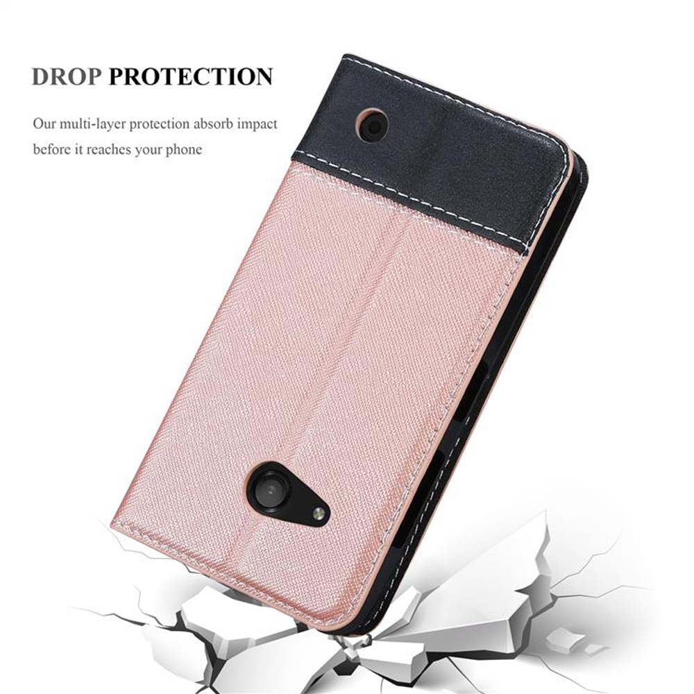 Una custodia per telefono rosa e nera, rotta sul bianco. La custodia sta cadendo.