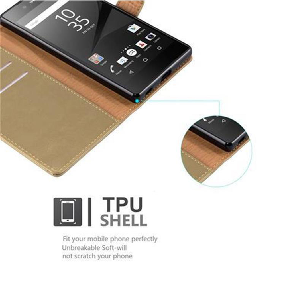 Smartphone nero in una custodia marrone con interno dorato. Testo: 'TPU SHELL' e descrizioni.