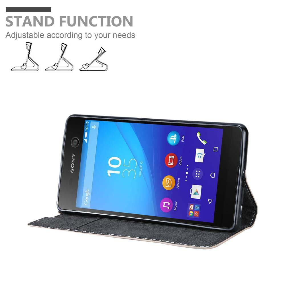 Smartphone con funda, pantalla mostrando hora y apps. Función soporte con posiciones ajustables. Funda gris y negra.