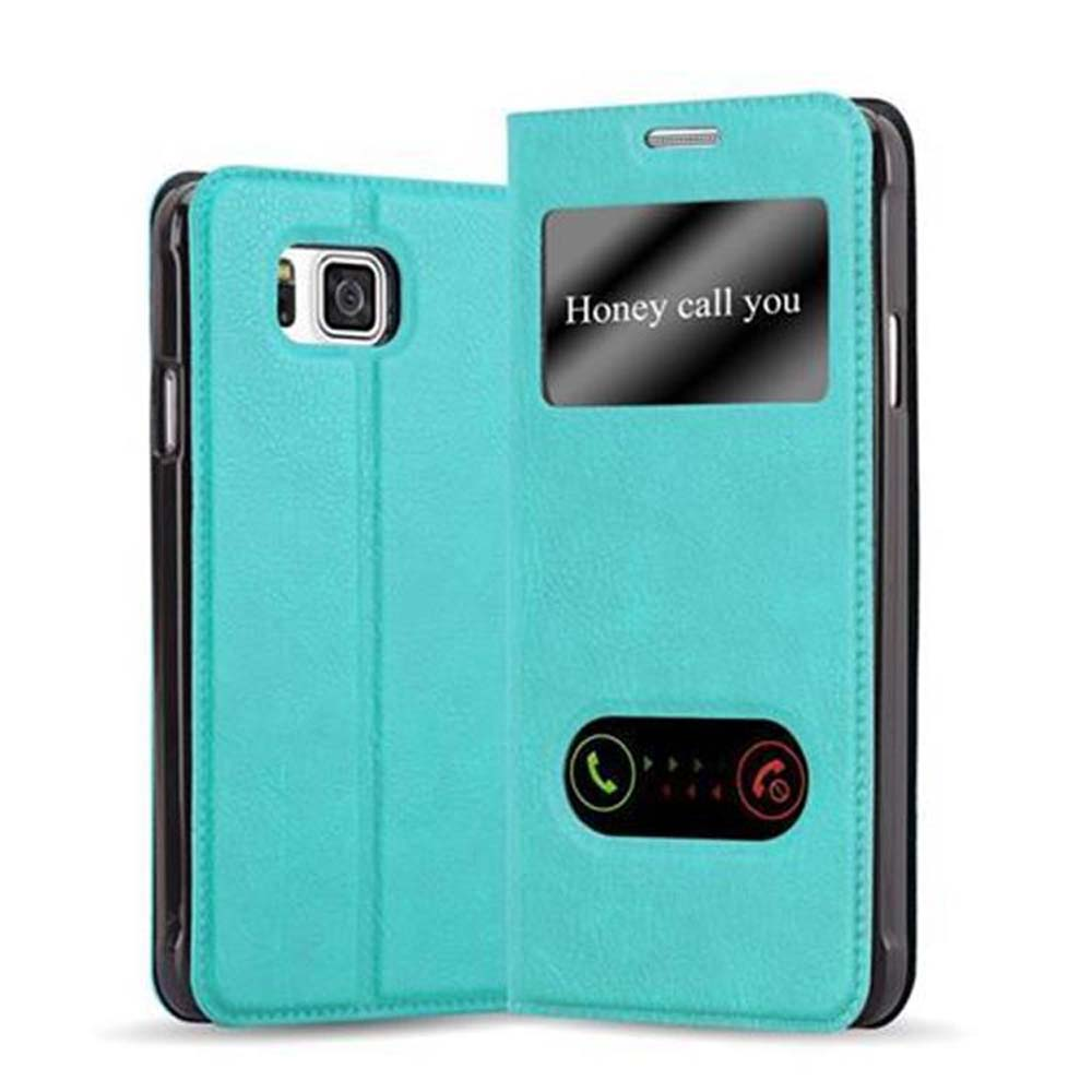 Funda de teléfono verde azulado con una ventana y el texto "Honey call you". El teléfono es visible.