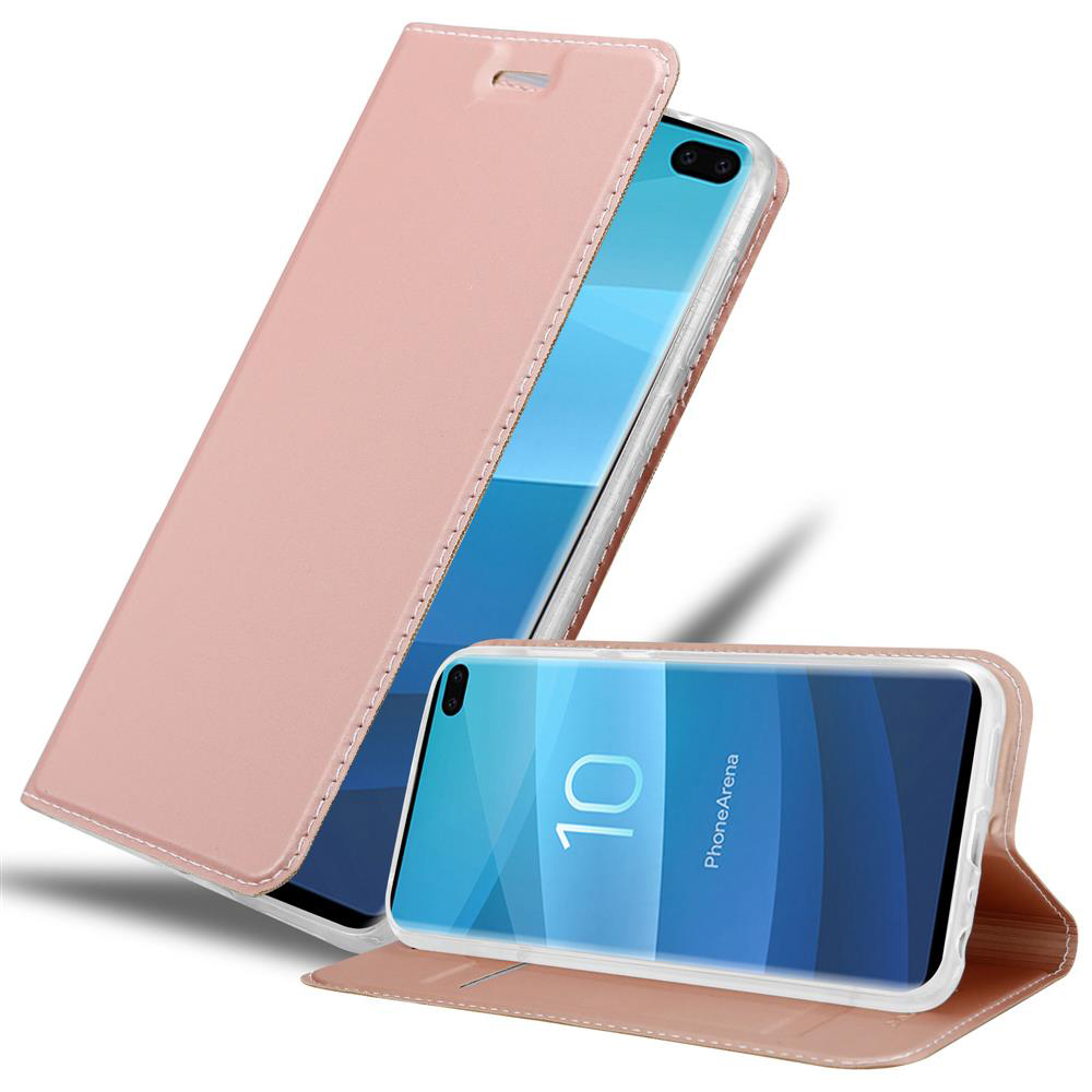 Eine rosa Handyhülle mit Telefon, offen und ein stehendes Telefon.
