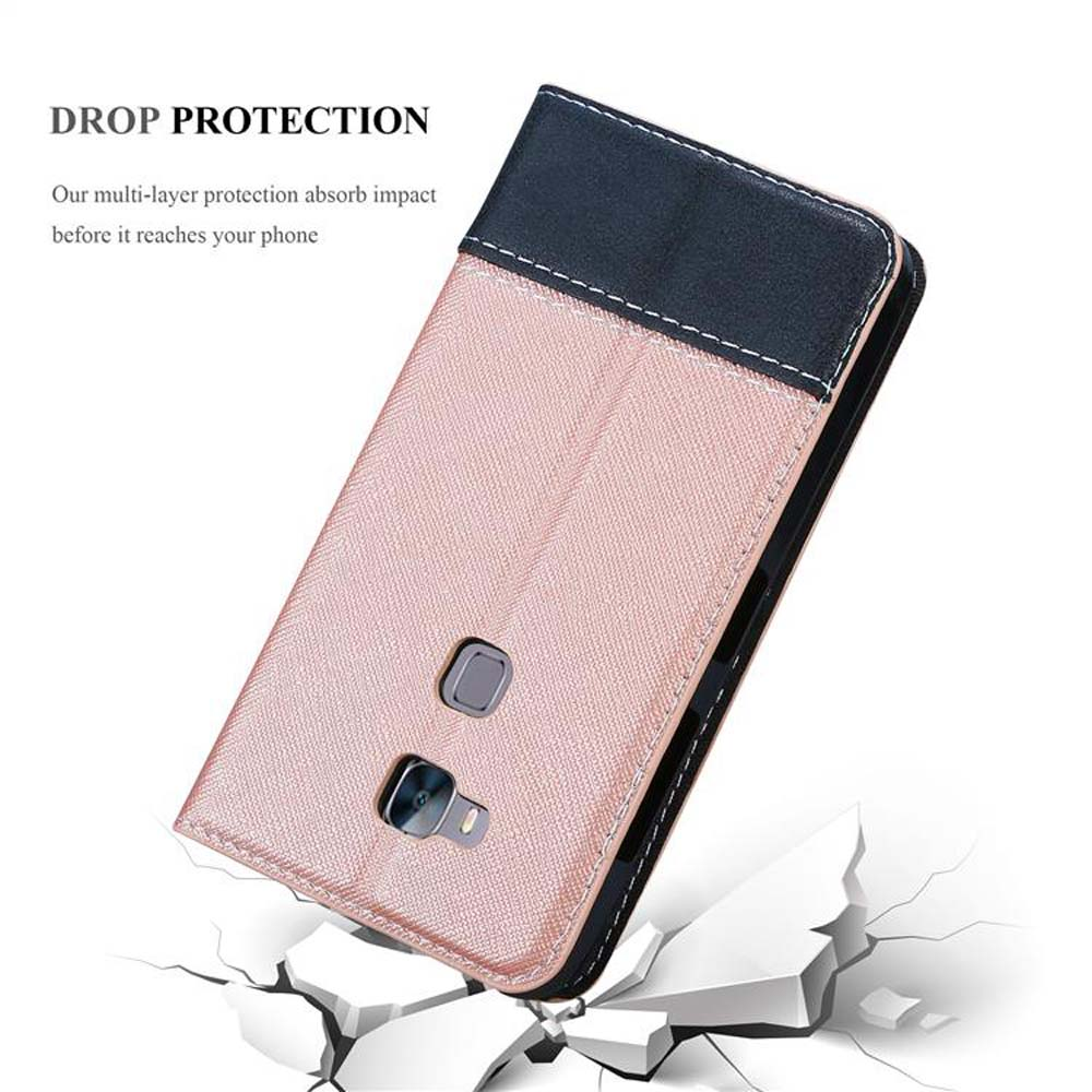Funda rosa y negra para teléfono sobre superficie blanca rota.