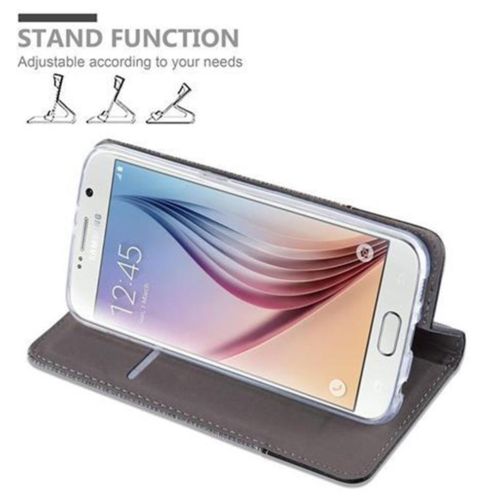Ein Telefon in einer Hülle ist geöffnet und steht. Das Telefon zeigt die Uhrzeit an. Die Hülle ist grau.