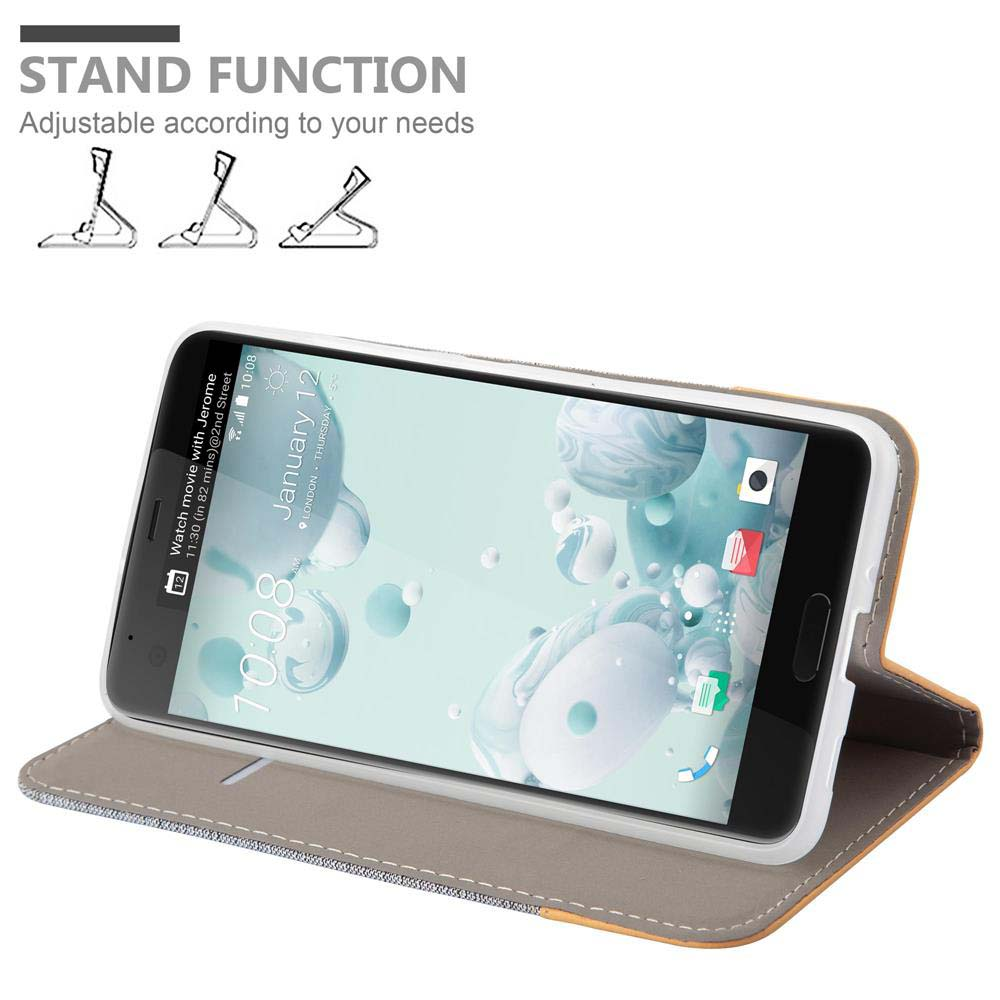 Custodia grigia e marrone con un telefono. Viene mostrata la funzione stand. Lo schermo del telefono è acceso.