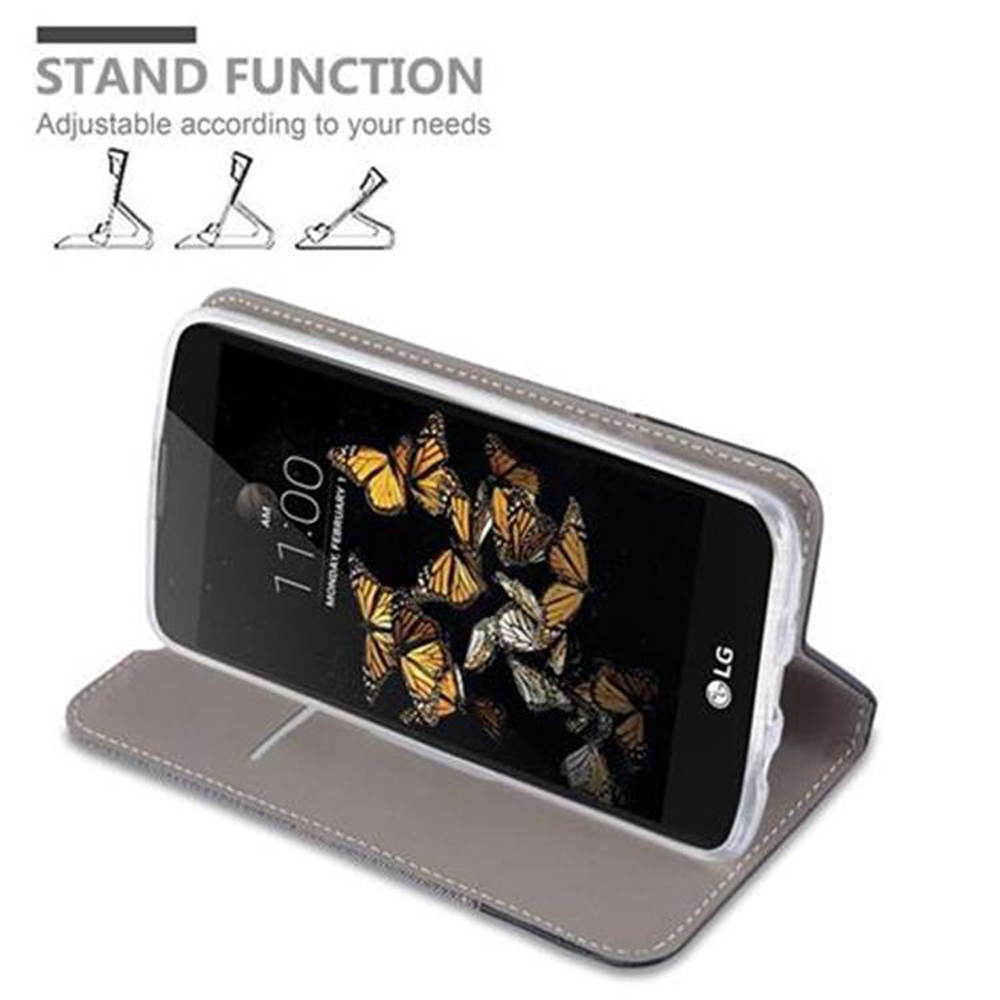 Telefono in custodia grigia con farfalle. Custodia aperta e supportata. Funzione stand.