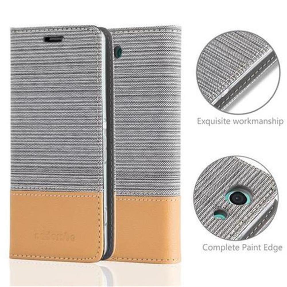 Funda de teléfono abierta, diseño gris y marrón. Texto: Mano de obra exquisita, borde de pintura completo.