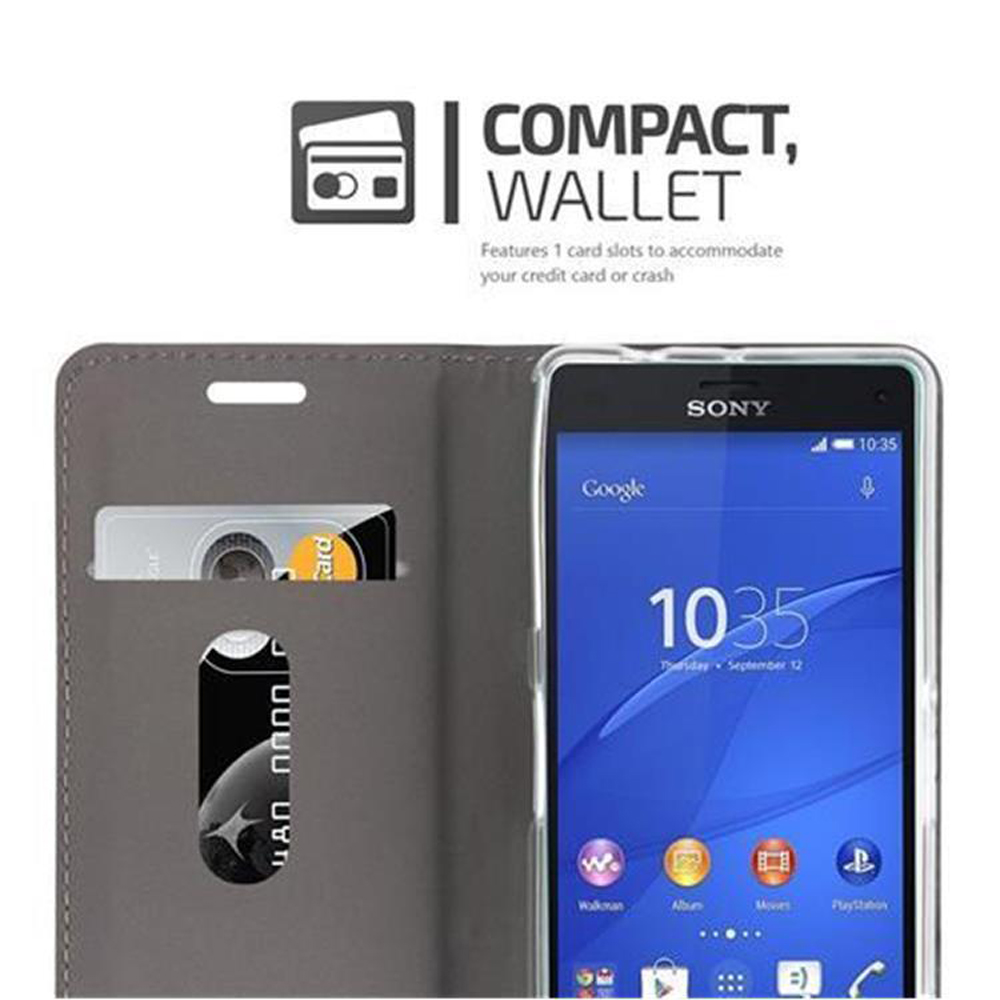 Teléfono en funda tipo cartera gris con tarjeta de crédito visible. Texto: 'COMPACT, WALLET'.
