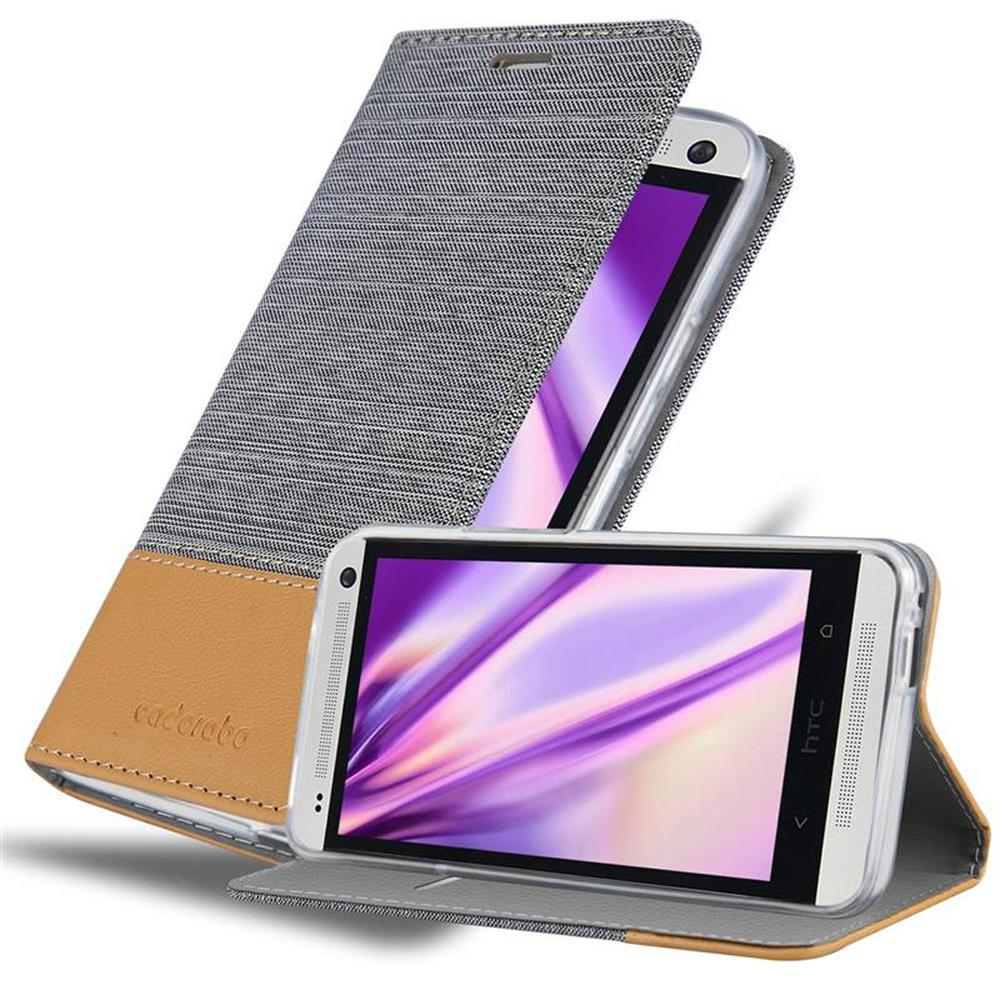 Tres fundas de teléfono abiertas. Tela gris y cuero marrón. La palabra 'cadorabo'. Teléfono HTC.