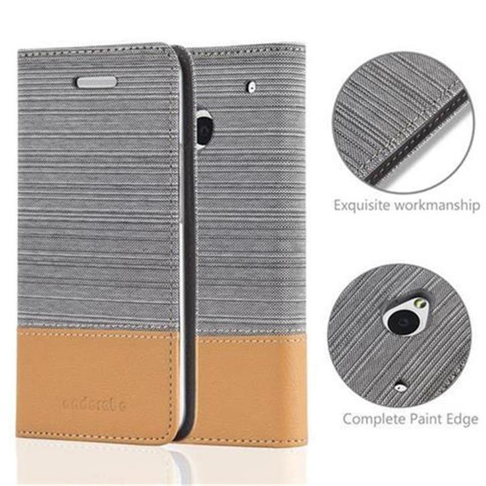 Funda gris y marrón claro, con detalles de fabricación y cámara de teléfono.
