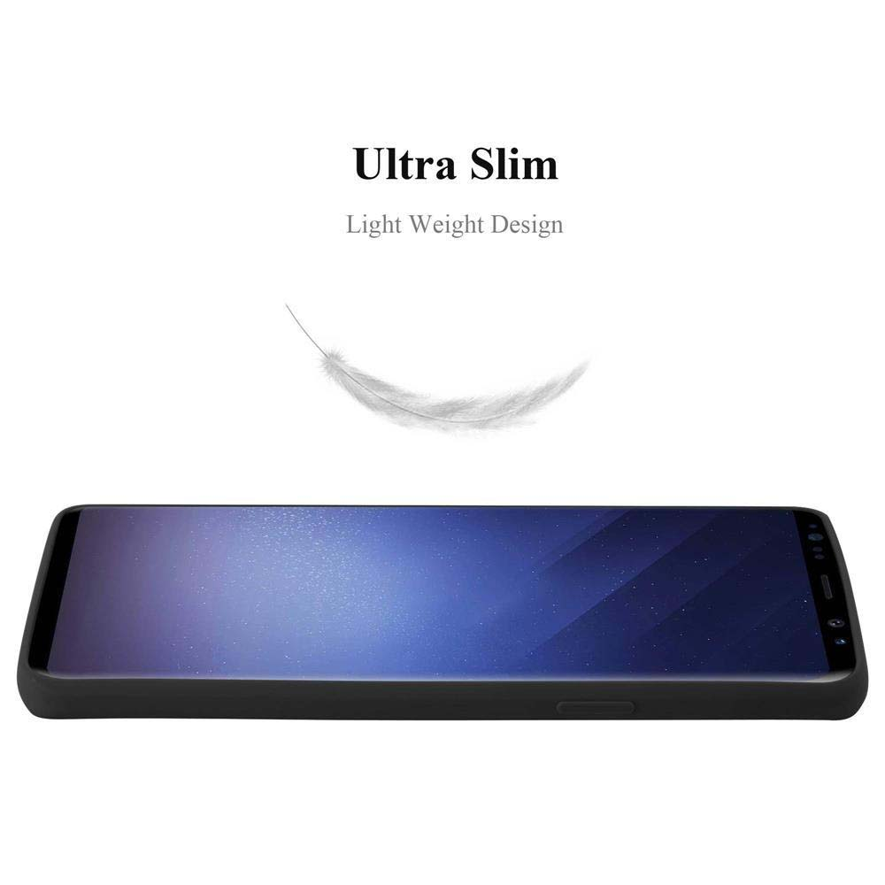 Telefono nero su sfondo bianco. Una piuma fluttua sopra il telefono.