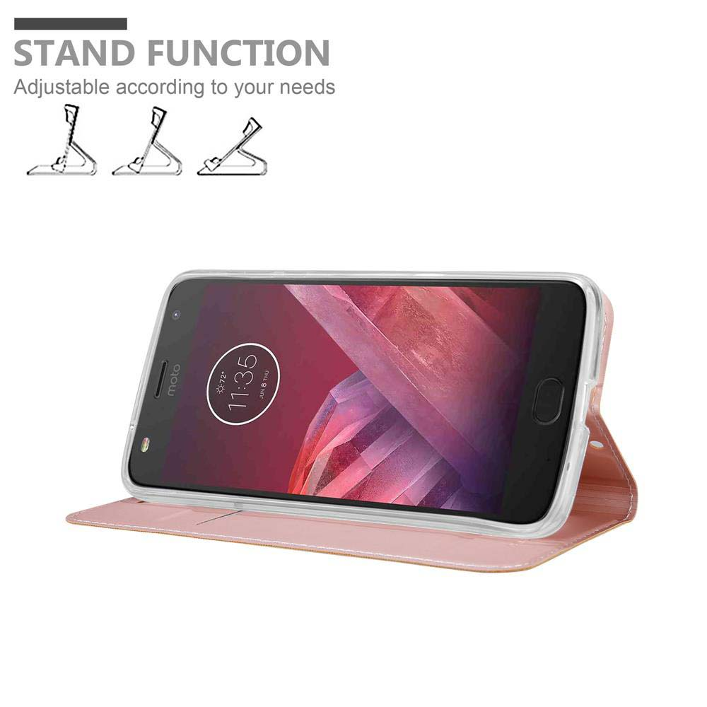 Un telefono in una custodia per telefono, aperto. La custodia è rosa. Il telefono è impostato per stare in piedi.