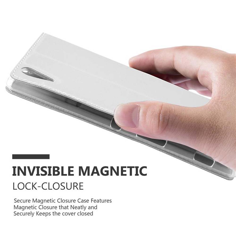 Se sostiene una funda blanca para teléfono. Dice 'INVISIBLE MAGNETIC LOCK-CLOSURE' y menciona un cierre magnético seguro.