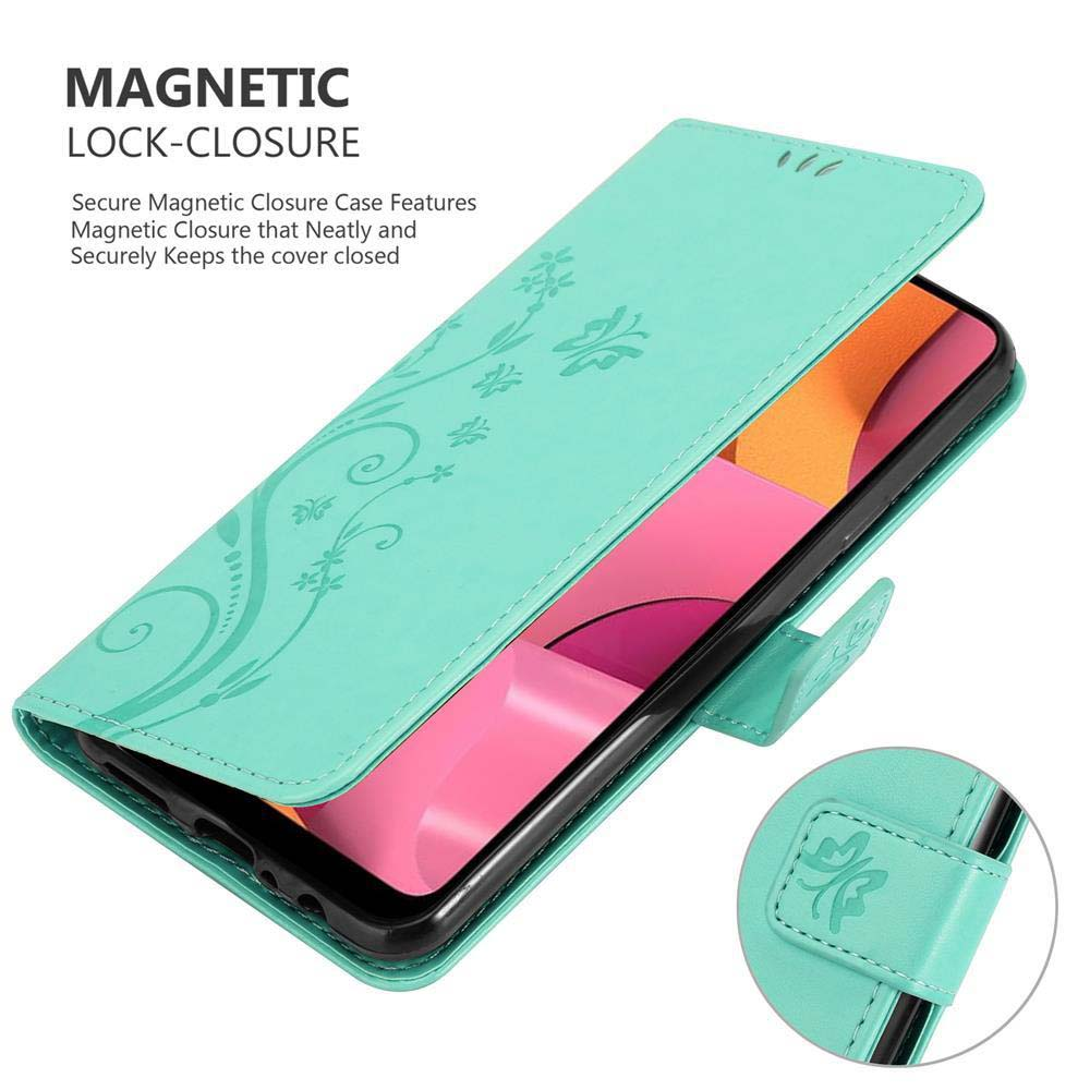 Custodia per telefono verde acqua aperta con design floreale, che tiene un telefono rosa, con dettaglio di chiusura magnetica.