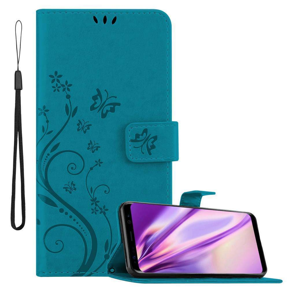 Custodia per telefono turchese con design a farfalla. Il telefono è dentro la custodia.