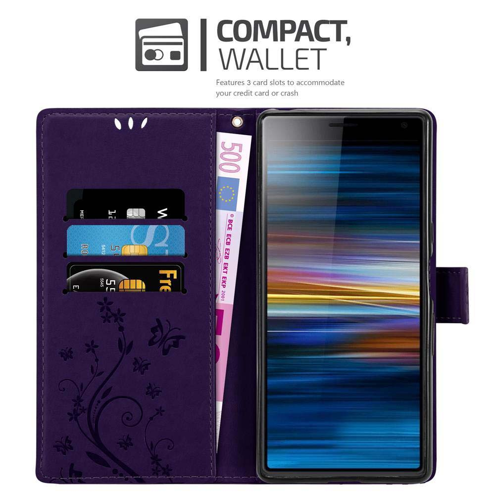 Custodia a portafoglio viola per telefono, con carte e denaro all'interno e un telefono. Fiori e farfalle sulla custodia.