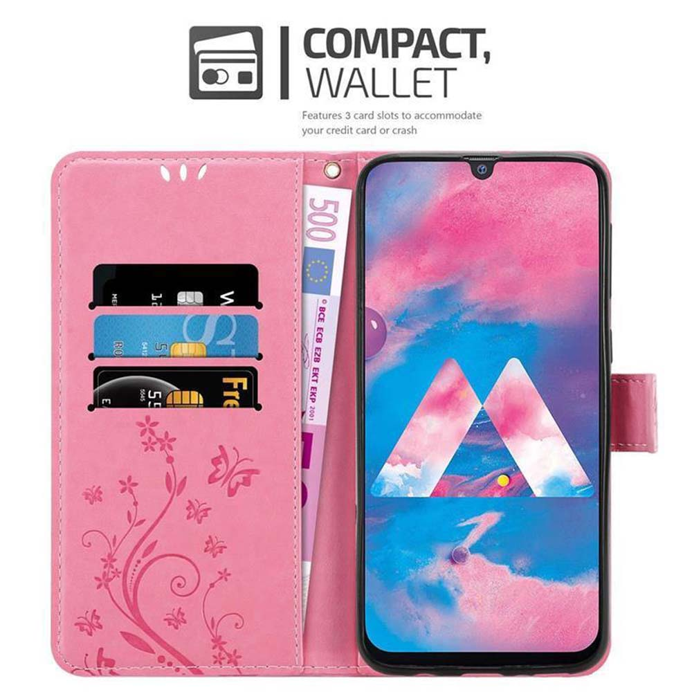 Custodia a portafoglio rosa con scomparti per telefono e carte. Include una banconota.
