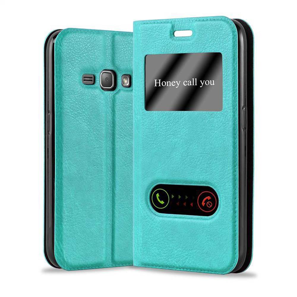 Funda de teléfono verde azulado con ventana. El teléfono muestra una pantalla de llamada.