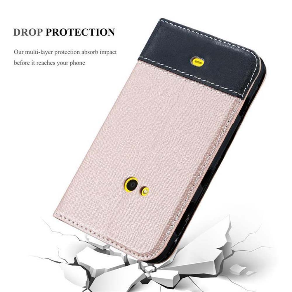 Funda rosa, parte superior y borde negros. Funda en el suelo, protección contra daños.