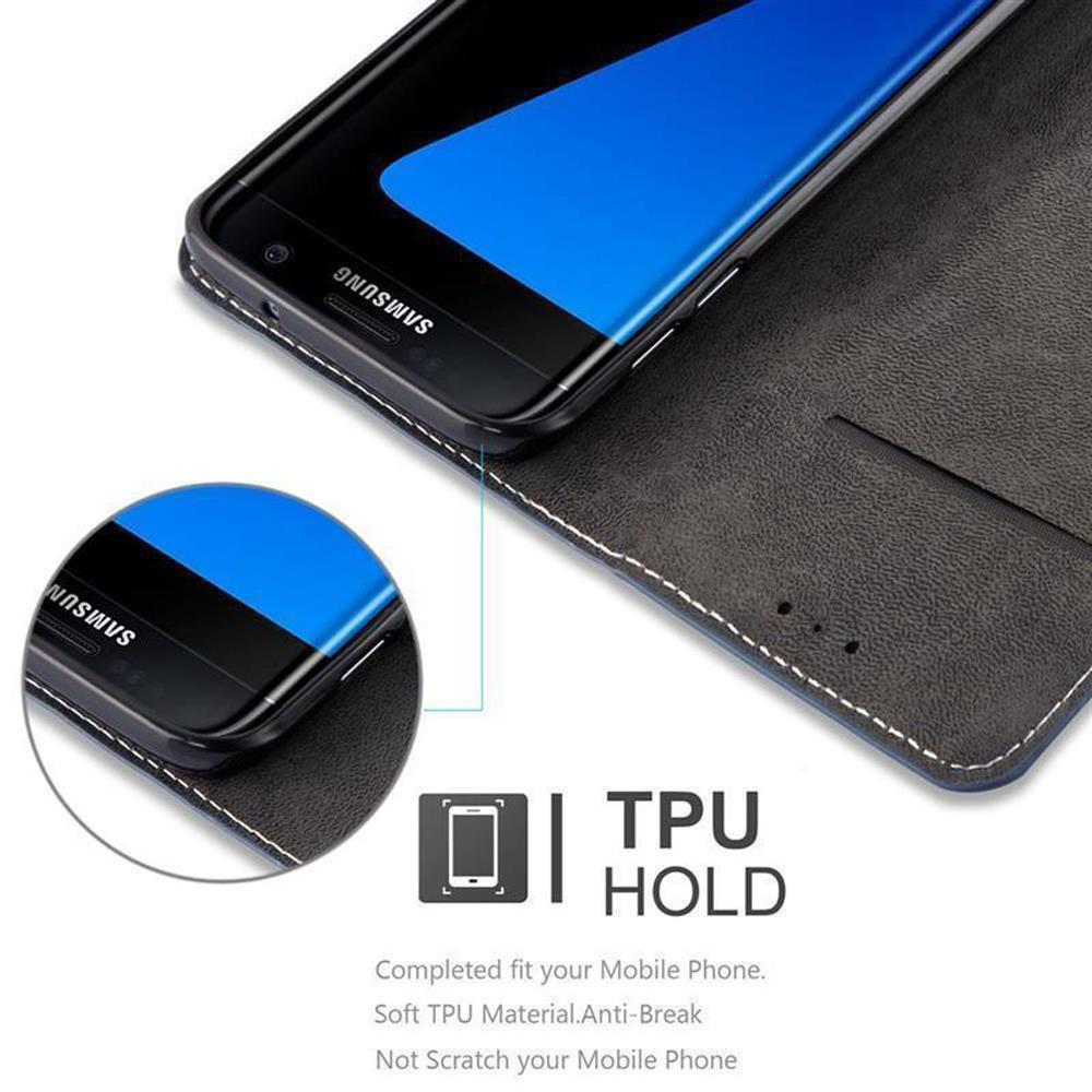 Teléfono en una funda. Pantalla azul visible, funda negra y azul. Logotipo de Samsung. Texto TPU HOLD.