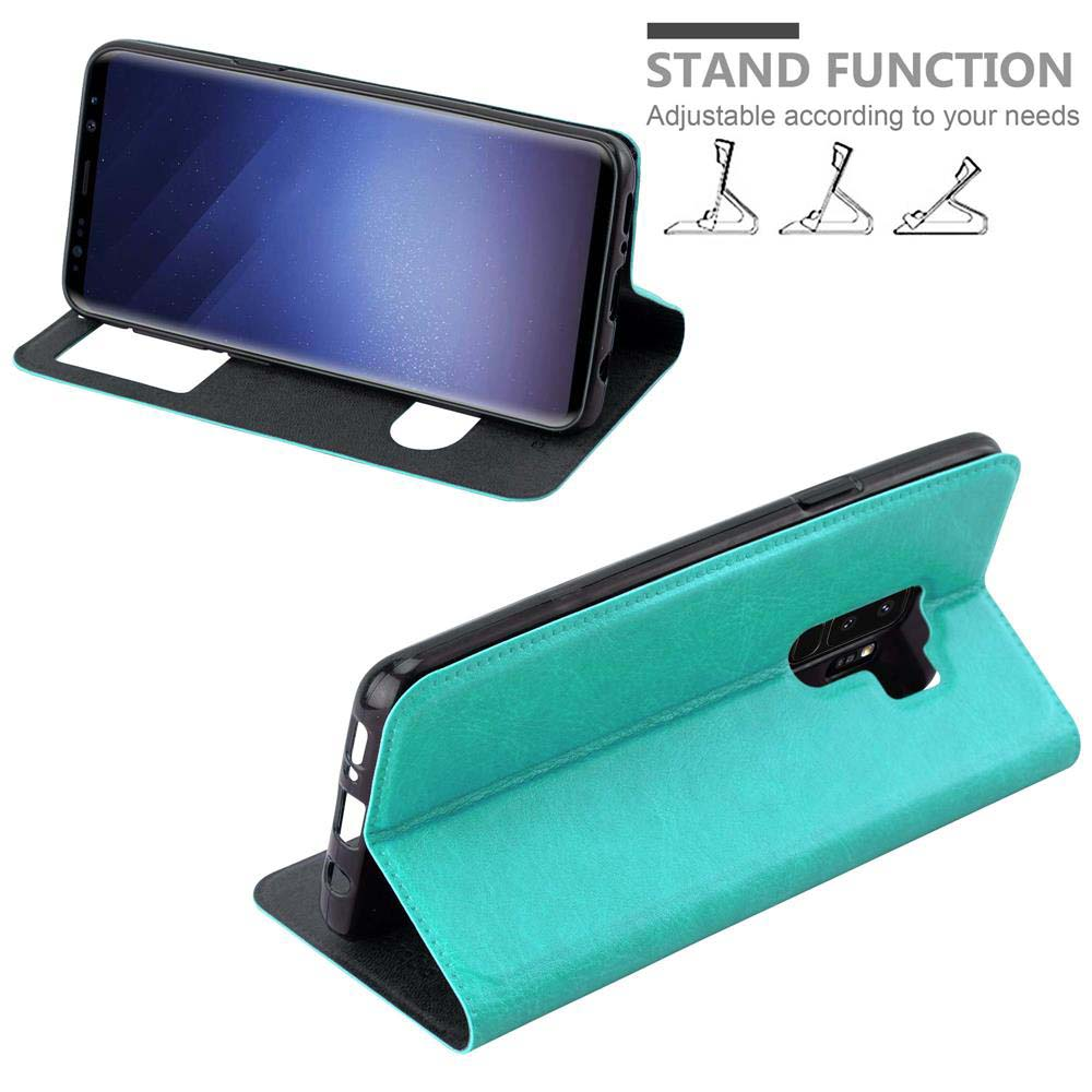 Un telefono in una custodia verde acqua è in piedi. Lo schermo del telefono è visibile e la custodia ha la funzione stand.