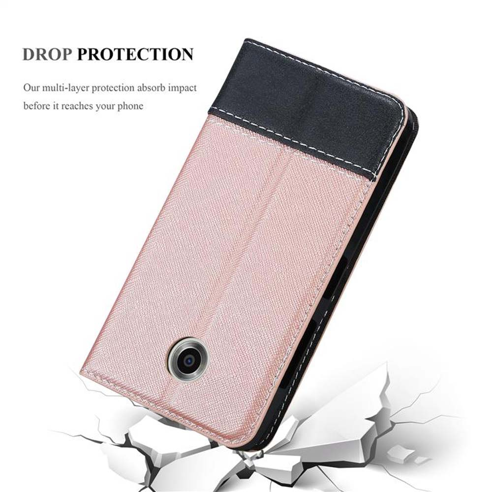 Funda de teléfono con protección contra caídas. Es rosa y negro. El teléfono está dentro.