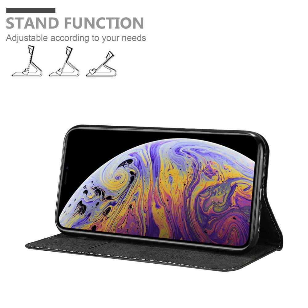 Telefon in schwarzem Case steht offen. Text „Standfunktion“ und Grafiken werden gezeigt. Telefonbildschirm sichtbar.