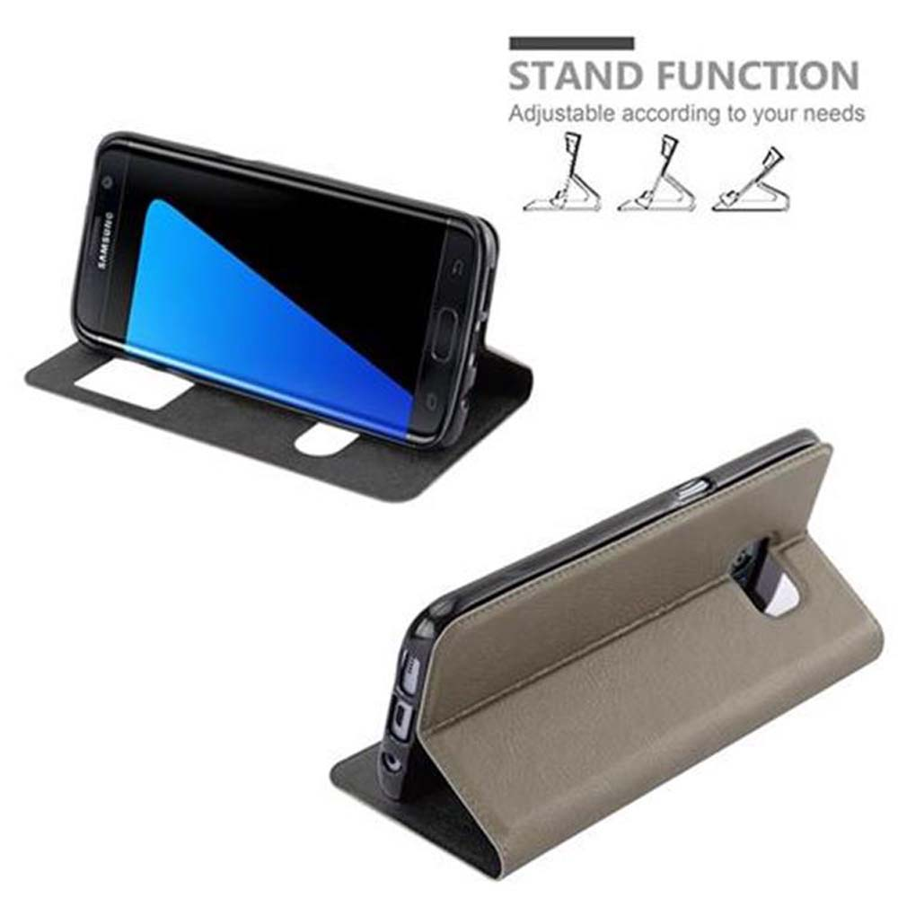 Custodia per telefono grigia con funzione stand. Il telefono è nella custodia.