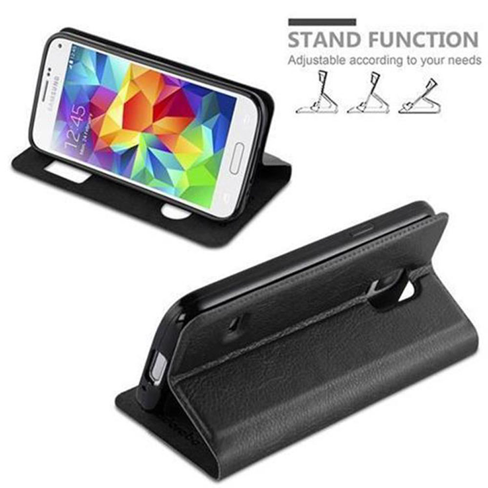 Un teléfono negro en una funda con función de soporte. El teléfono está apoyado para su visualización.