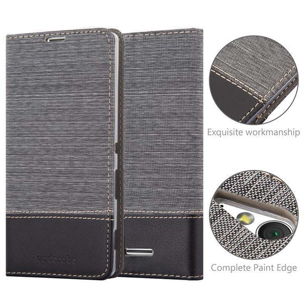 Funda de teléfono gris, plegada. Primer plano de las costuras y el orificio de la cámara. Mano de obra exquisita.